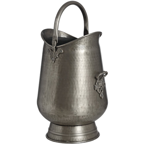 Antique pewter coal bucket with ornate handle and leaf motifs, against a white background.