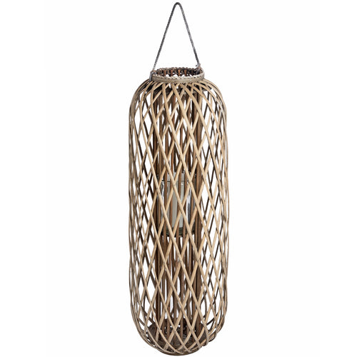 A tall cylindrical wicker lantern with a light inside, meant for outdoor decoration.