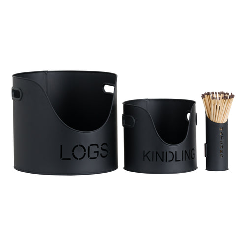 Two black metal buckets labeled 'LOGS' and 'KINDLING', and a black matchstick holder with wooden matches