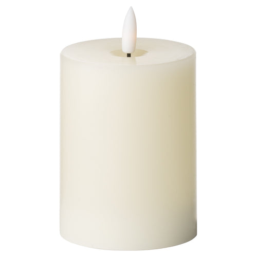 An LED cream candle from the Luxe Collection, designed to mimic a traditional flameless glow.