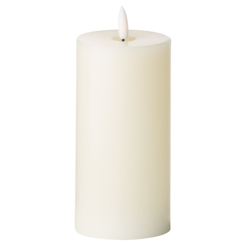 An LED cream candle with a realistic appearance, providing a natural glow.