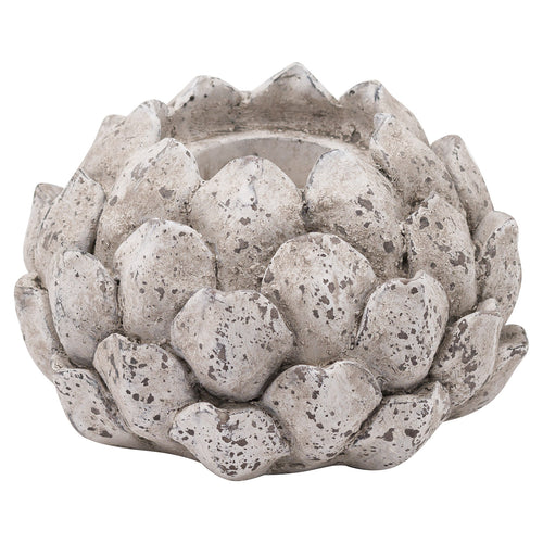 A stone effect acorn-shaped tea light holder.
