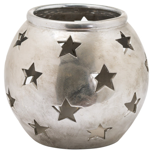 A small silver tea light lantern with star cut-outs on the surface.