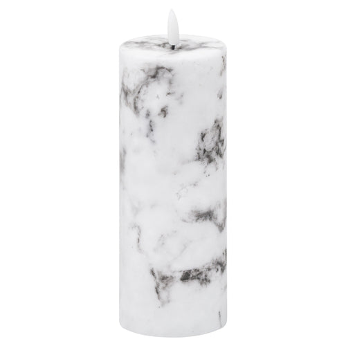 A battery-operated LED candle with a marble effect finish, displaying a natural glow.