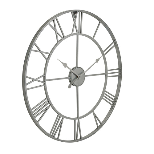 A silver skeleton wall clock with a round shape and Roman numerals.