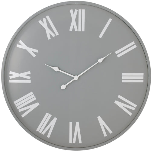 A large wall clock with a light grey face, white Roman numerals, and white clock hands.