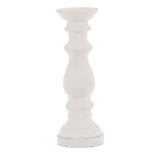 A matte white ceramic candle holder with a column-like structure, displaying light and shadow on its surface.