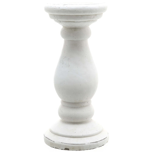 A matte white ceramic candle holder with a cylindrical form.