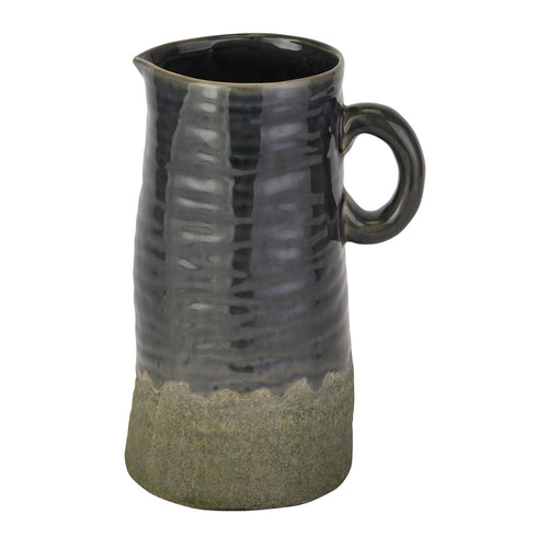 Black and green ceramic pitcher on a white background