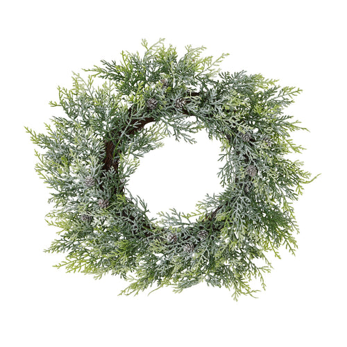 A frosted pine wreath with pinecones against a white background.