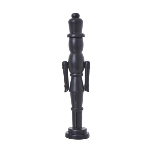 A black wooden nutcracker decoration in a traditional design with a solid color and no visible patterns.