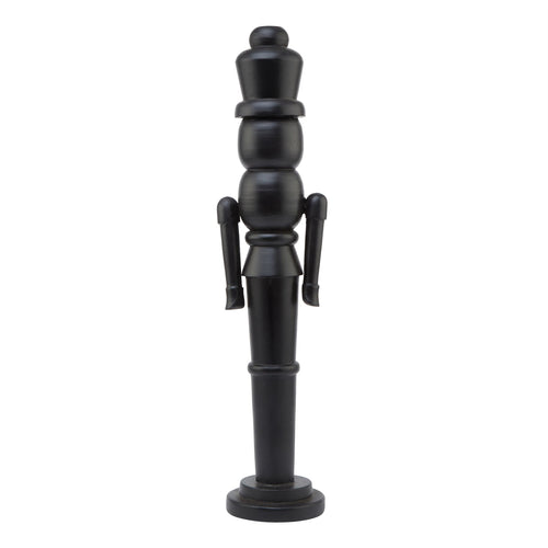 A large black wooden nutcracker decoration with a traditional design, standing upright.