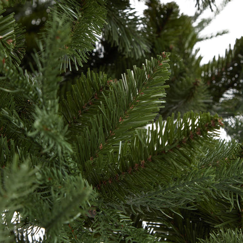 Close-up of a green artificial Christmas tree