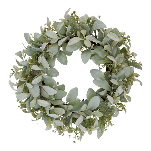 A circular wreath made of lamb's ear foliage and wax flowers against a white background.