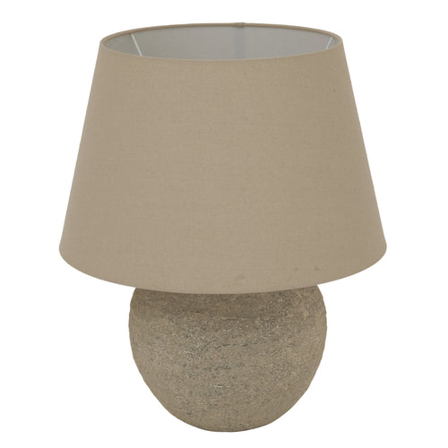 A Tuscan grey lamp with a round base and a beige lampshade.
