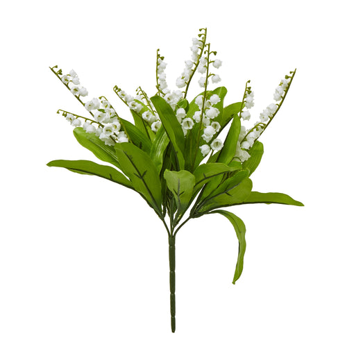 A faux floral arrangement depicting a bunch of white bell-shaped flowers with green foliage.