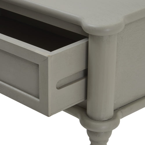Corner with open drawer of a gray two-drawer console table with spindle legs and a lower shelf.