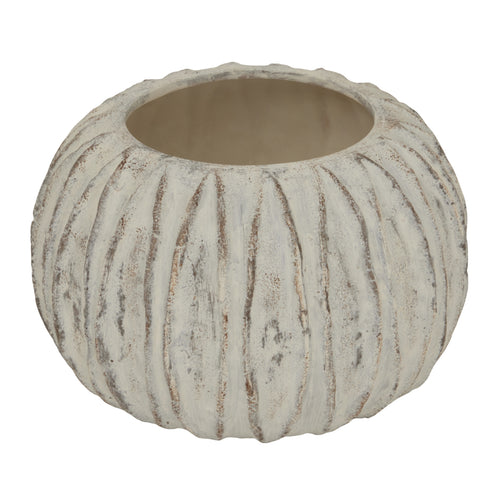 A beige round vase with a sculpted fin texture