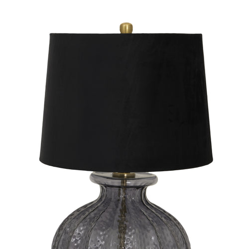 The top of a Luxton glass fluted lamp with a black velvet shade and a gold base, part of the Luxton collection.