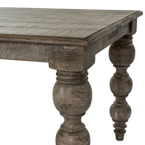 Wooden table with decorative legs on a white background