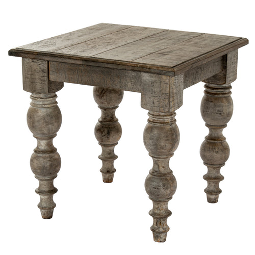 Wooden side table with turned legs on a white background