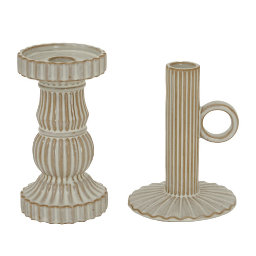 Two ceramic candle holders on a white background