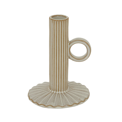 Decorative ceramic candle holder with ribbed design on a white background