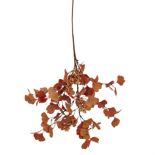 Artificial autumn leaf branch with berries on a white background