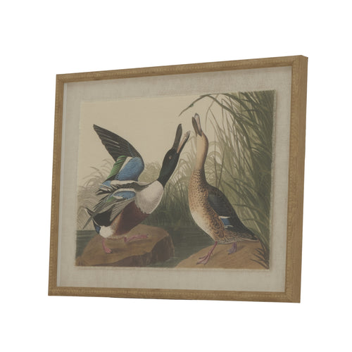 A framed artwork depicting two mallard ducks in a natural setting with greenery in the background, housed in a beaded frame.