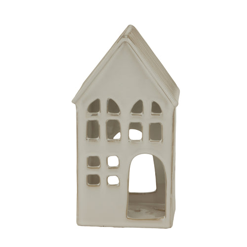 Decorative house-shaped candle holder on a white background