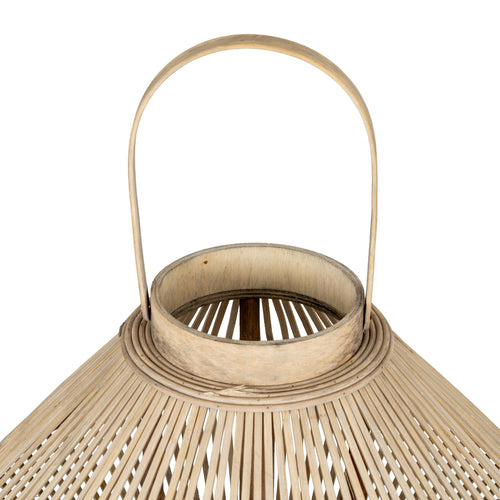 Close-up of a beige woven lantern with a handle on a white background