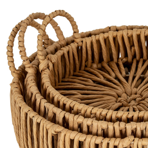 Close up of Woven basket with handles on a white background