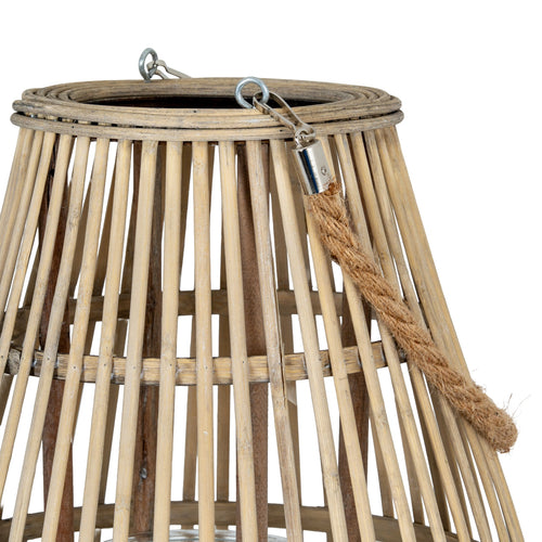 Woven basket with rope handle on a white background