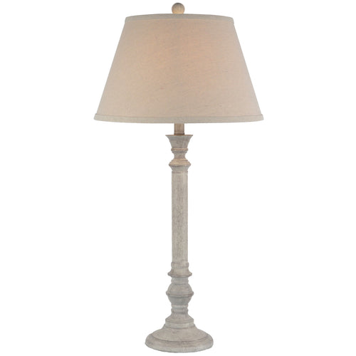 Table lamp with beige shade on a white background