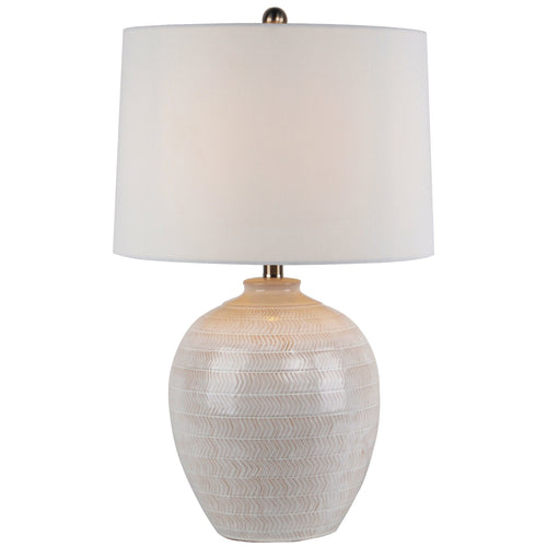 Table lamp with textured white base and white shade on a white background