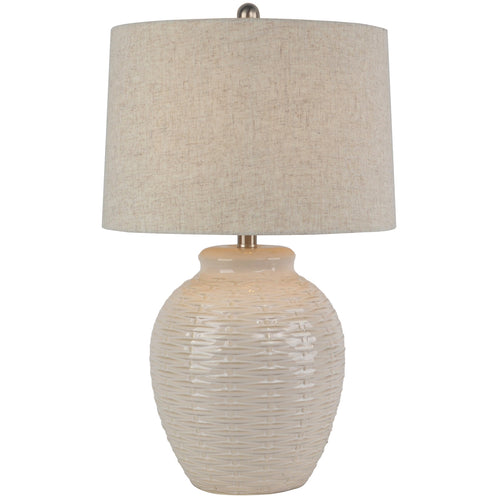 Table lamp with textured beige base and shade on a white background