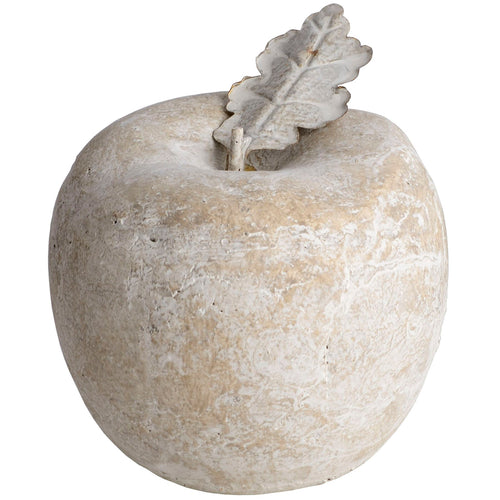 Decorative stone apple with a leaf on a white background
