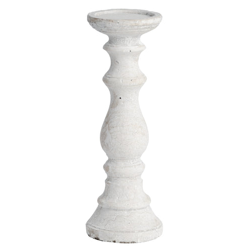 A white stone candle holder with a cylindrical top and textured column.